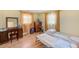 Comfortable bedroom with two beds, wood floors and natural light at 1831 Kay Dr, Largo, FL 33770
