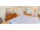 Comfortable bedroom with hardwood floors, large dresser and large mirror at 1831 Kay Dr, Largo, FL 33770