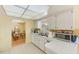 Kitchen boasts ample counter space, updated appliances, and a view into the adjoining dining room at 1831 Kay Dr, Largo, FL 33770