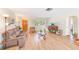 Inviting living room with wood floors, comfortable seating, and a charming home-like feel at 1831 Kay Dr, Largo, FL 33770