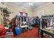 Spacious bedroom showcasing racks of clothing and accessories at 1900 17Th S St, St Petersburg, FL 33712