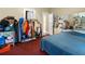 Comfortable bedroom featuring a bed, closet with clothing, and a mirrored dresser at 1900 17Th S St, St Petersburg, FL 33712