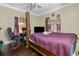 Inviting bedroom featuring a large bed, desk and wood floors at 1900 17Th S St, St Petersburg, FL 33712