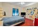 Cozy bedroom with a ceiling fan, large window, and ample closet space at 1900 17Th S St, St Petersburg, FL 33712