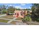 A single Gathering peach colored home with an arched entryway and small front yard at 1900 17Th S St, St Petersburg, FL 33712