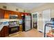 Well-maintained kitchen featuring tile flooring, and stainless steel appliances at 1900 17Th S St, St Petersburg, FL 33712
