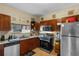 Well-maintained kitchen featuring tile flooring, and stainless steel appliances at 1900 17Th S St, St Petersburg, FL 33712