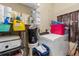 Functional laundry room with washer, dryer, and storage shelves for cleaning supplies at 1900 17Th S St, St Petersburg, FL 33712
