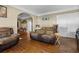 Spacious living room with hardwood floors, comfortable seating, and access to dining area at 1900 17Th S St, St Petersburg, FL 33712