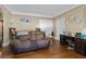 Inviting living room with wood floors, a comfy sofa, and neutral paint palette at 1900 17Th S St, St Petersburg, FL 33712