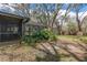 Large fenced yard with a screened porch and inground pool at 2503 Withy Ct, Tampa, FL 33618