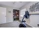 Neutral guest bedroom area with a large closet and fitness equipment at 2504 Woodcote Ter, Palm Harbor, FL 34685