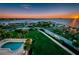 Stunning aerial view of a waterfront community featuring a pool, landscaping, and bay access at 2530 Gary Cir # 401, Dunedin, FL 34698