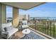 Cozy balcony featuring comfortable seating and stunning water views, perfect for relaxing or entertaining at 2530 Gary Cir # 401, Dunedin, FL 34698