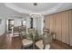 Contemporary dining room with a round table and stylish overhead lighting at 2530 Gary Cir # 401, Dunedin, FL 34698