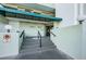 Exterior view of the entrance to the Marina Tower condo building with a covered awning and sign at 2530 Gary Cir # 401, Dunedin, FL 34698
