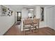 Hallway features bar stool seating, decorative art, and outdoor access at 2530 Gary Cir # 401, Dunedin, FL 34698