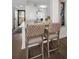 Hallway features bar stool seating, decorative art, and outdoor access at 2530 Gary Cir # 401, Dunedin, FL 34698
