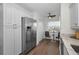 Bright kitchen with stainless steel refrigerator and breakfast nook at 2530 Gary Cir # 401, Dunedin, FL 34698