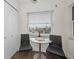 Eat-in kitchen area with black chairs overlooking city view at 2530 Gary Cir # 401, Dunedin, FL 34698