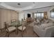 Open floor plan with a dining area, comfortable living room seating, and a view of the ocean at 2530 Gary Cir # 401, Dunedin, FL 34698