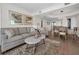 Inviting living room with hardwood floors, modern lighting, and stylish furniture offers a comfortable living space at 2530 Gary Cir # 401, Dunedin, FL 34698