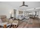 Spacious living room with a reclining chair, hardwood floors, and an open layout combines comfort with style at 2530 Gary Cir # 401, Dunedin, FL 34698