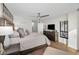 Spacious bedroom with a serene view, modern decor, and a ceiling fan at 2530 Gary Cir # 401, Dunedin, FL 34698