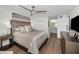 Bright bedroom with a ceiling fan, stylish furnishings, and lots of closet space at 2530 Gary Cir # 401, Dunedin, FL 34698