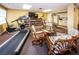 Well-appointed recreation room offering fitness equipment, cozy seating, and convenient access to a kitchenette at 2530 Gary Cir # 401, Dunedin, FL 34698
