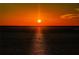 Majestic sunset with vibrant colors reflecting off a calm body of water at 2530 Gary Cir # 401, Dunedin, FL 34698