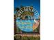 Welcome to Dunedin Causeway sign under a clear blue sky surrounded by tropical greenery at 2530 Gary Cir # 401, Dunedin, FL 34698