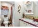 Well-maintained bathroom features a vanity and a shower with curtain at 3110 Moss Hill St, Wesley Chapel, FL 33543