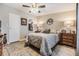 Bedroom showcasing a neutral color scheme, wooden flooring, and a decorative area rug at 3110 Moss Hill St, Wesley Chapel, FL 33543