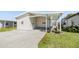 Charming home with a covered carport and well-maintained lawn, perfect for enjoying outdoor living at 3110 Moss Hill St, Wesley Chapel, FL 33543