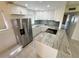 Modern kitchen featuring stainless steel appliances, beautiful countertops, and white cabinets at 3300 Fox Chase N Cir # 229, Palm Harbor, FL 34683