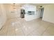 Bright kitchen features white cabinets, stainless steel appliances, and a tiled backsplash at 3300 Fox Chase N Cir # 229, Palm Harbor, FL 34683
