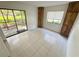 This open room features a sliding glass door to a screened in patio at 3300 Fox Chase N Cir # 229, Palm Harbor, FL 34683