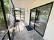 This is a view of the screened in porch at 3300 Fox Chase N Cir # 229, Palm Harbor, FL 34683