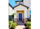 Inviting home entrance featuring a classic blue door, brick walkway, and stone accents at 3367 Janna Grace Way, Land O Lakes, FL 34638