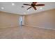 This bonus room features tile floors, neutral walls and a ceiling fan at 3416 S 70Th St, Tampa, FL 33619