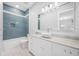 Bathroom featuring an integrated tub/shower, granite counter, and a vessel sink at 3709 W Dale Ave, Tampa, FL 33609