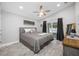 Serene bedroom features a large window, ceiling fan, and sliding glass doors leading to the backyard at 3709 W Dale Ave, Tampa, FL 33609