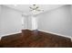 Open bedroom featuring wood flooring, a ceiling fan, and natural lighting at 3709 W Dale Ave, Tampa, FL 33609