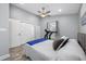 Relaxing bedroom featuring a comfortable bed, ample closet space, and a ceiling fan for added comfort at 3709 W Dale Ave, Tampa, FL 33609