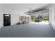 Spacious two-car garage with ample storage and access to the outdoors at 3709 W Dale Ave, Tampa, FL 33609