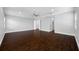 Spacious main bedroom with dark wood floors and ensuite bath featuring a walk-in closet at 3709 W Dale Ave, Tampa, FL 33609