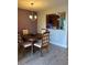 Well-lit dining room with view of kitchen and outdoor space at 4237 Brentwood Park Cir, Tampa, FL 33624