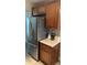 A modern refrigerator and kitchen counter in the kitchen at 4237 Brentwood Park Cir, Tampa, FL 33624