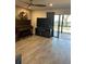 Inviting living room with hardwood floors, ceiling fan, and sliding glass doors to the patio at 4237 Brentwood Park Cir, Tampa, FL 33624